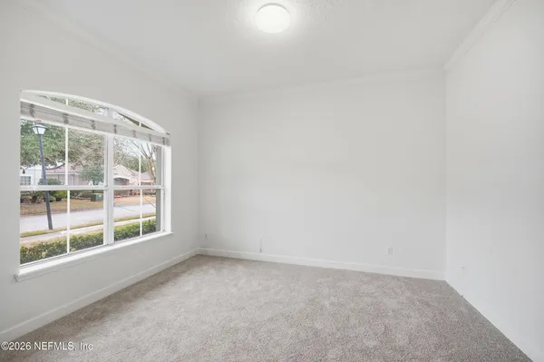 a view of kitchen with furniture and a ceiling fan