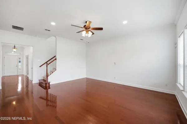 a kitchen with granite countertop cabinets stove top oven and microwave