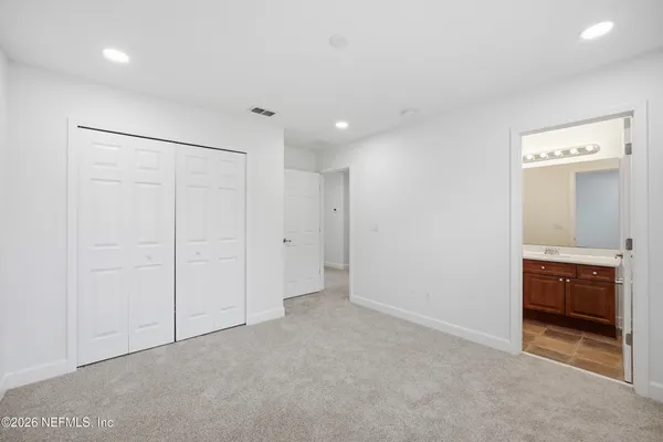an aerial view of a resort with swimming pool and outdoor seating
