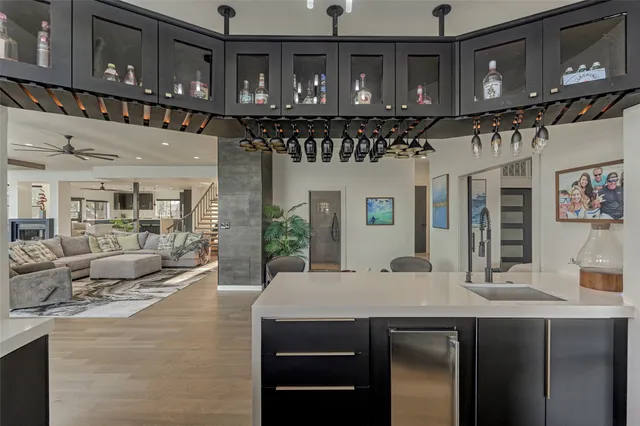a kitchen with stainless steel appliances granite countertop a sink and cabinets
