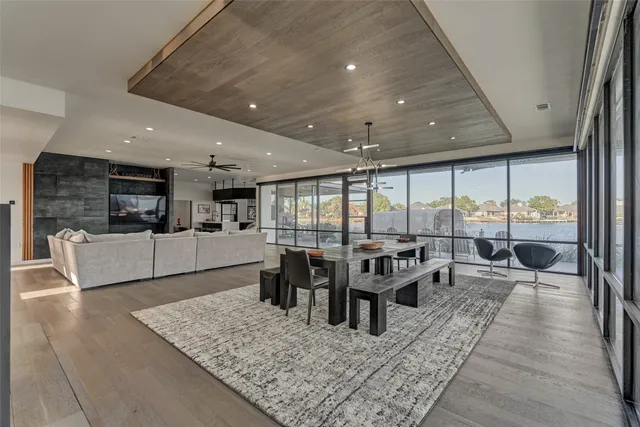 a living room with lots of furniture and large windows