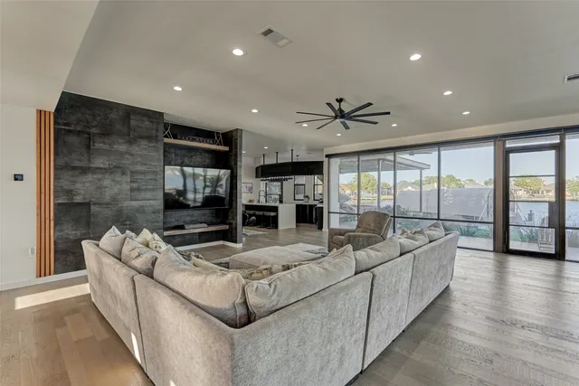 a living room with fireplace furniture and a flat screen tv