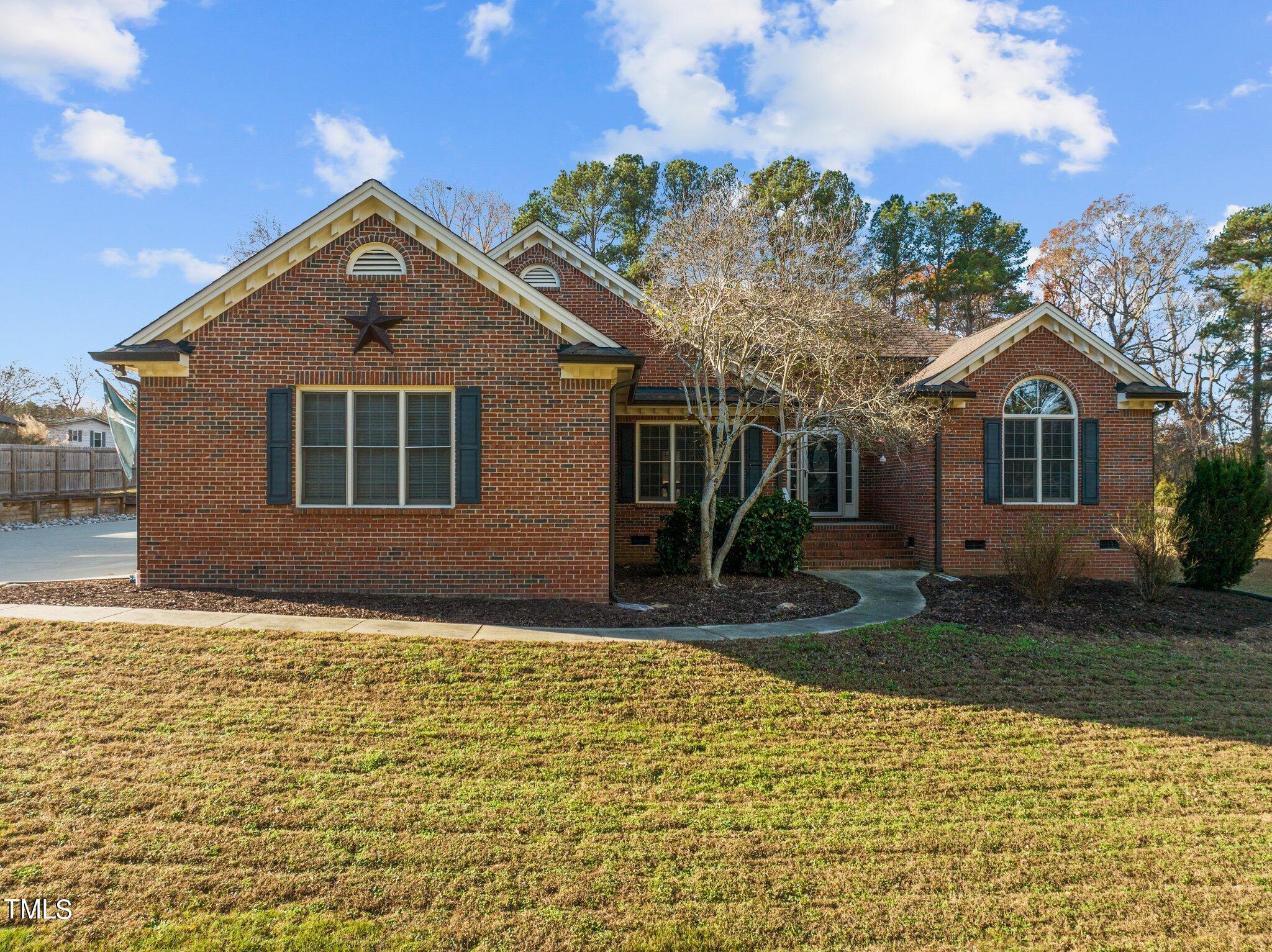 209 Priceview Drive Raleigh, NC 27603 - Photo 1 of 20 a front view of a house with a yard