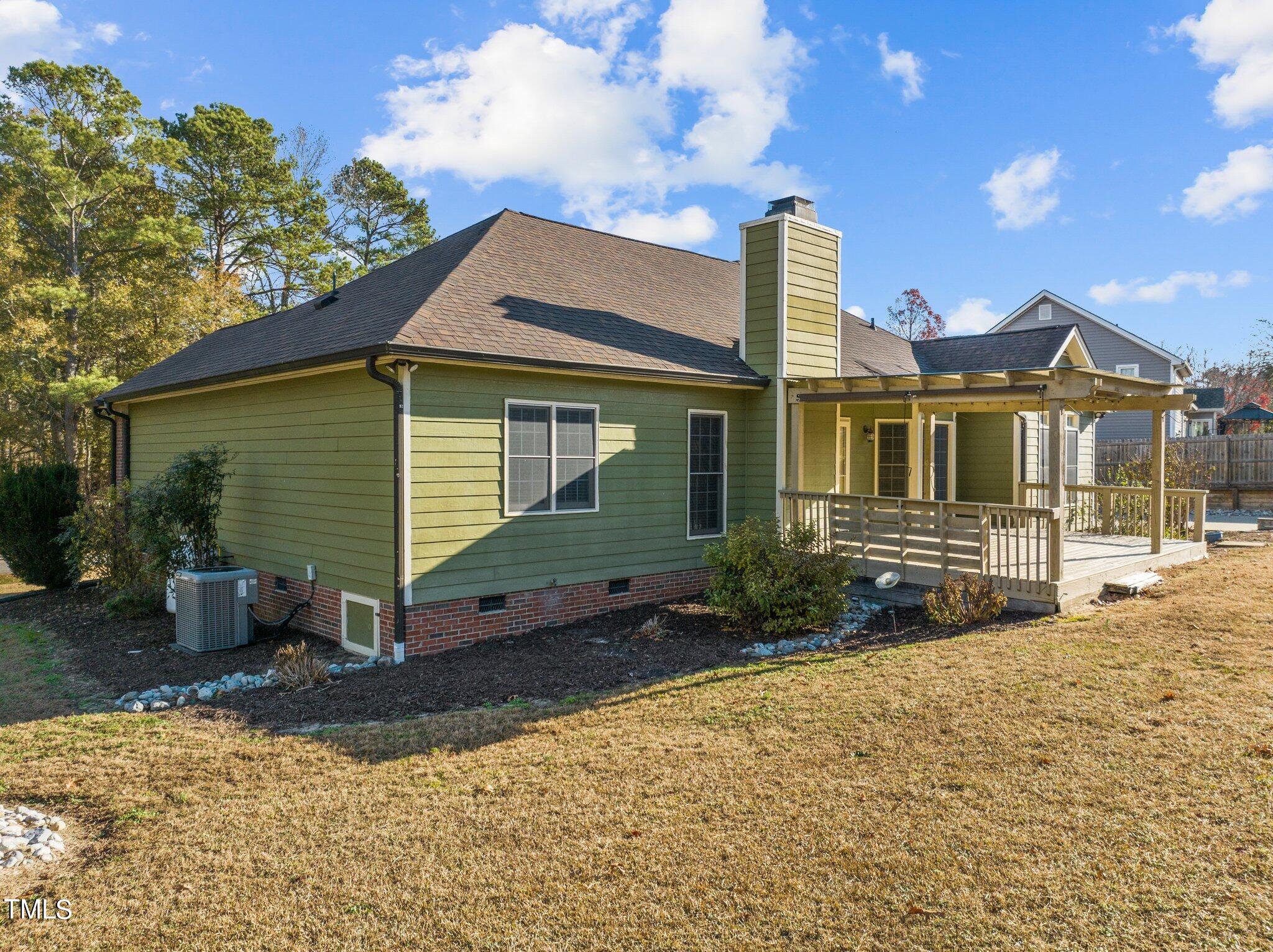 209 Priceview Drive Raleigh, NC 27603 - Photo 14 of 20 a front view of a house with a yard and garage