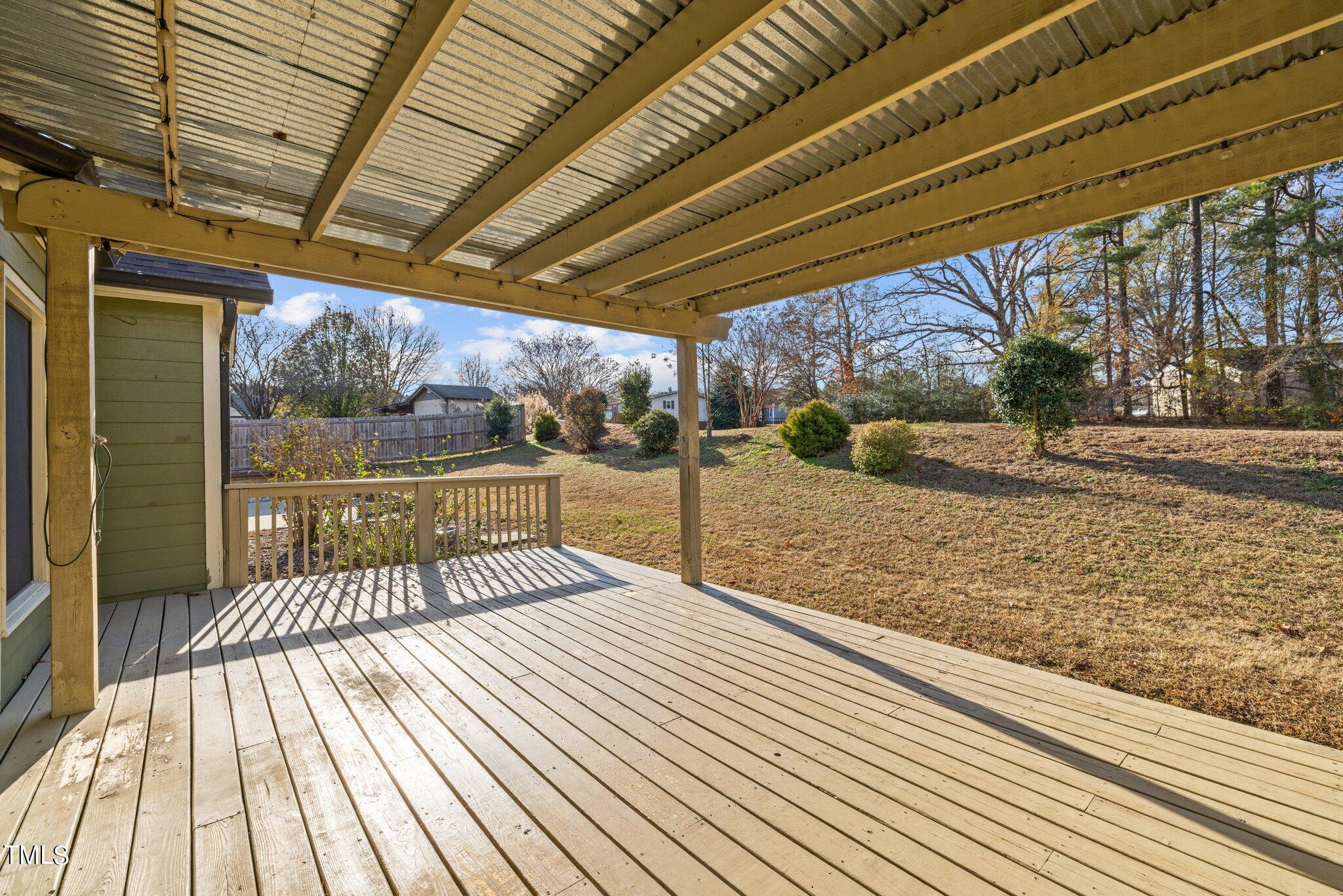 209 Priceview Drive Raleigh, NC 27603 - Photo 16 of 20 a view of a backyard with wooden floor