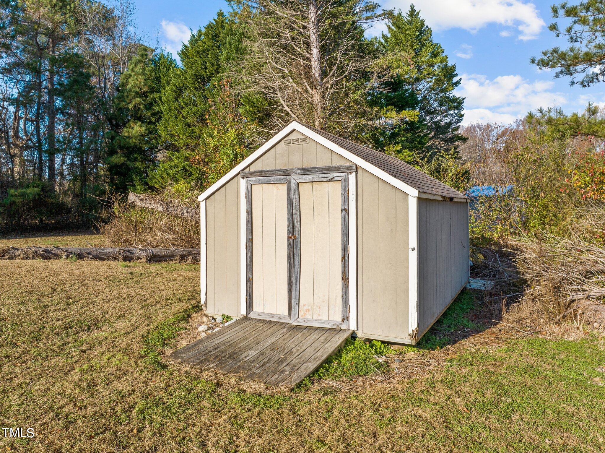 209 Priceview Drive Raleigh, NC 27603 - Photo 20 of 20 a view of a backyard of the house