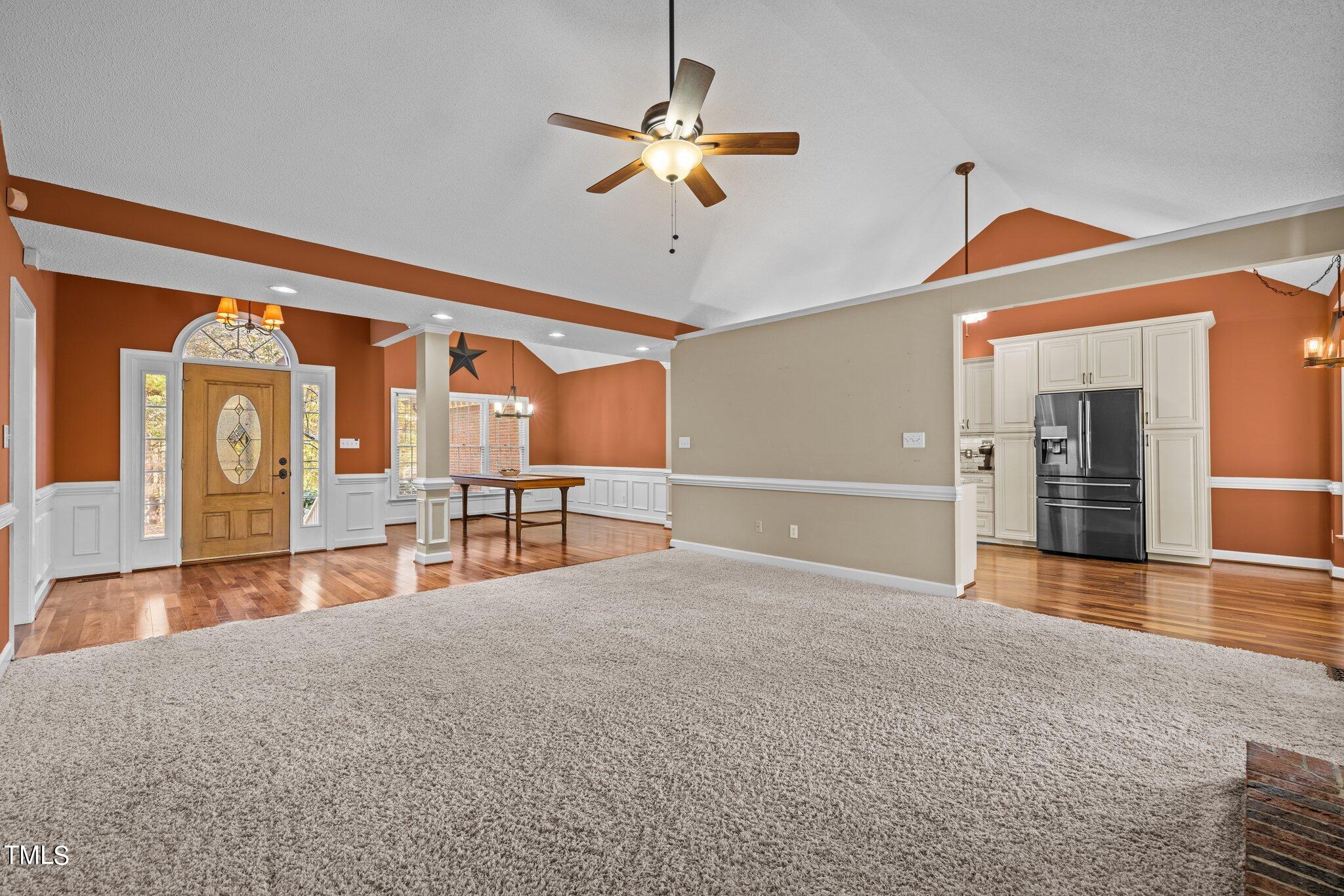 209 Priceview Drive Raleigh, NC 27603 - Photo 2 of 20 a view of an empty room with a ceiling fan
