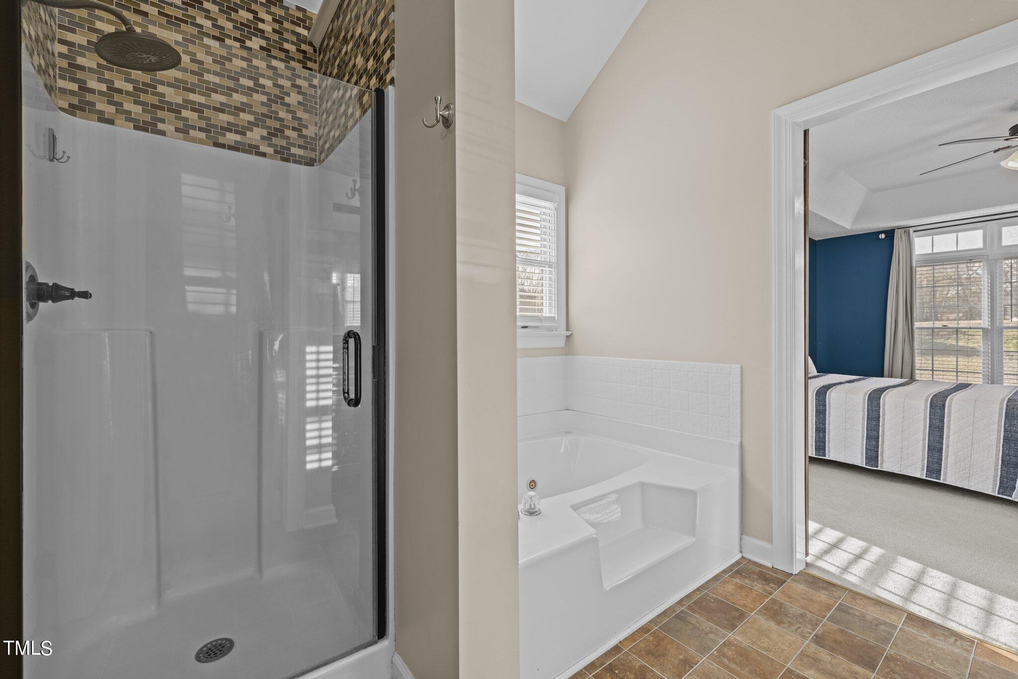 209 Priceview Drive Raleigh, NC 27603 - Photo 10 of 20 a bathroom with a bathtub and shower