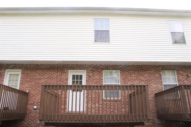 a front view of a house with a fence