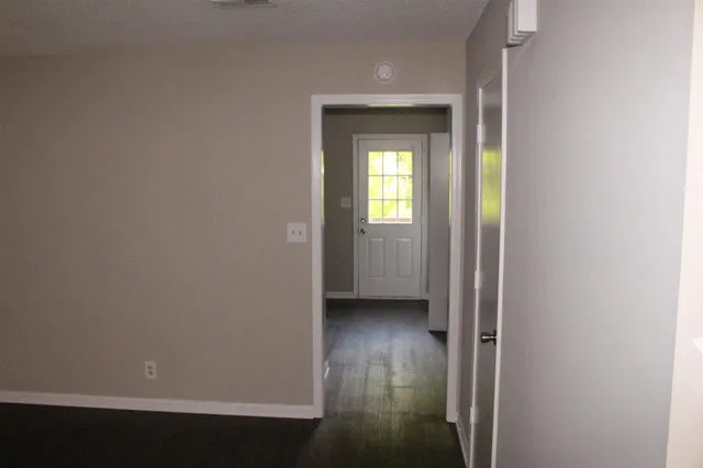 a view of an empty room with a window