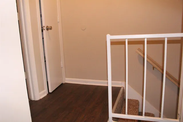 an entryway with wooden floor
