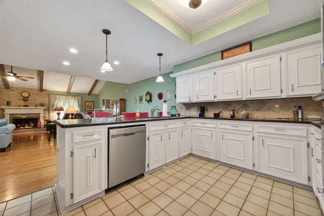 a kitchen with granite countertop cabinets and steel stainless steel appliances