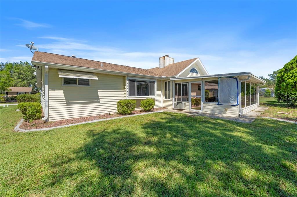 8170 Southwest 109 Street Road Ocala, FL 34481 - Photo 2 of 18 a front view of a house with a yard