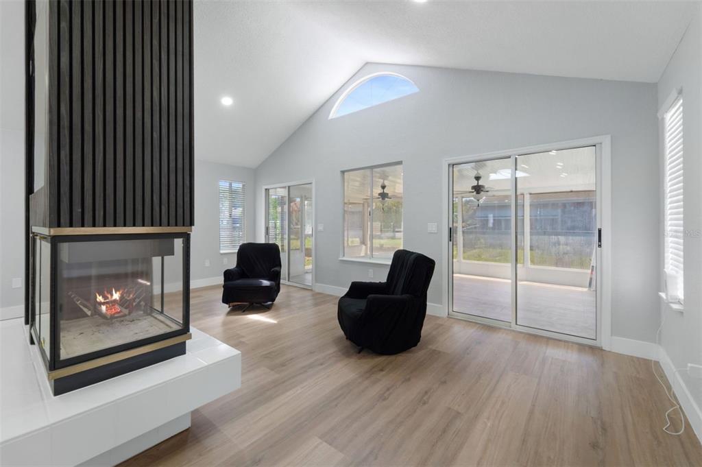 8170 Southwest 109 Street Road Ocala, FL 34481 - Photo 4 of 18 a living room with furniture and a fireplace