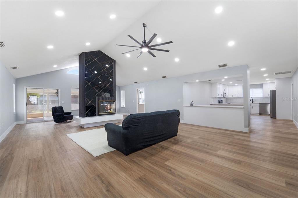 8170 Southwest 109 Street Road Ocala, FL 34481 - Photo 6 of 18 a living room with furniture and a wooden floor