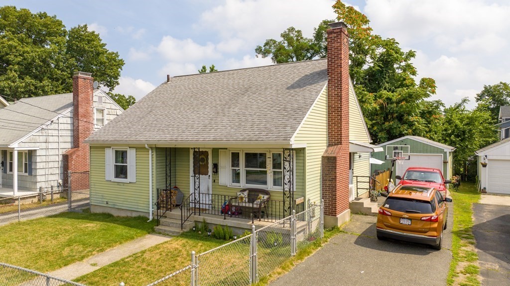 41 Shawmut Street Springfield, MA 01108 - Photo 1 of 39 a view of a patio with table and chairs and potted plants