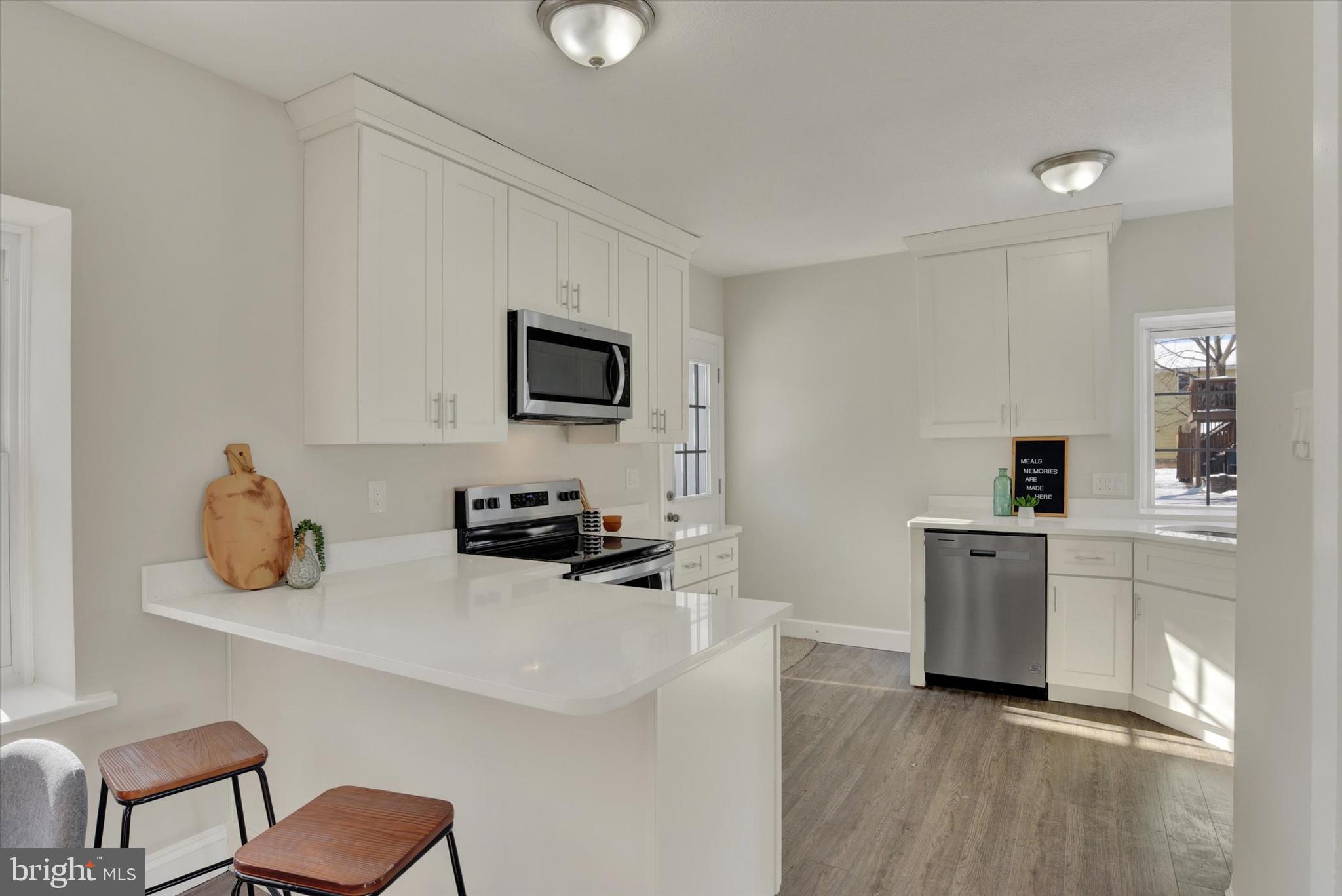 420 Walnut Street East Cleona, PA 17042 - Photo 10 of 30 a kitchen with a sink cabinets and wooden floor