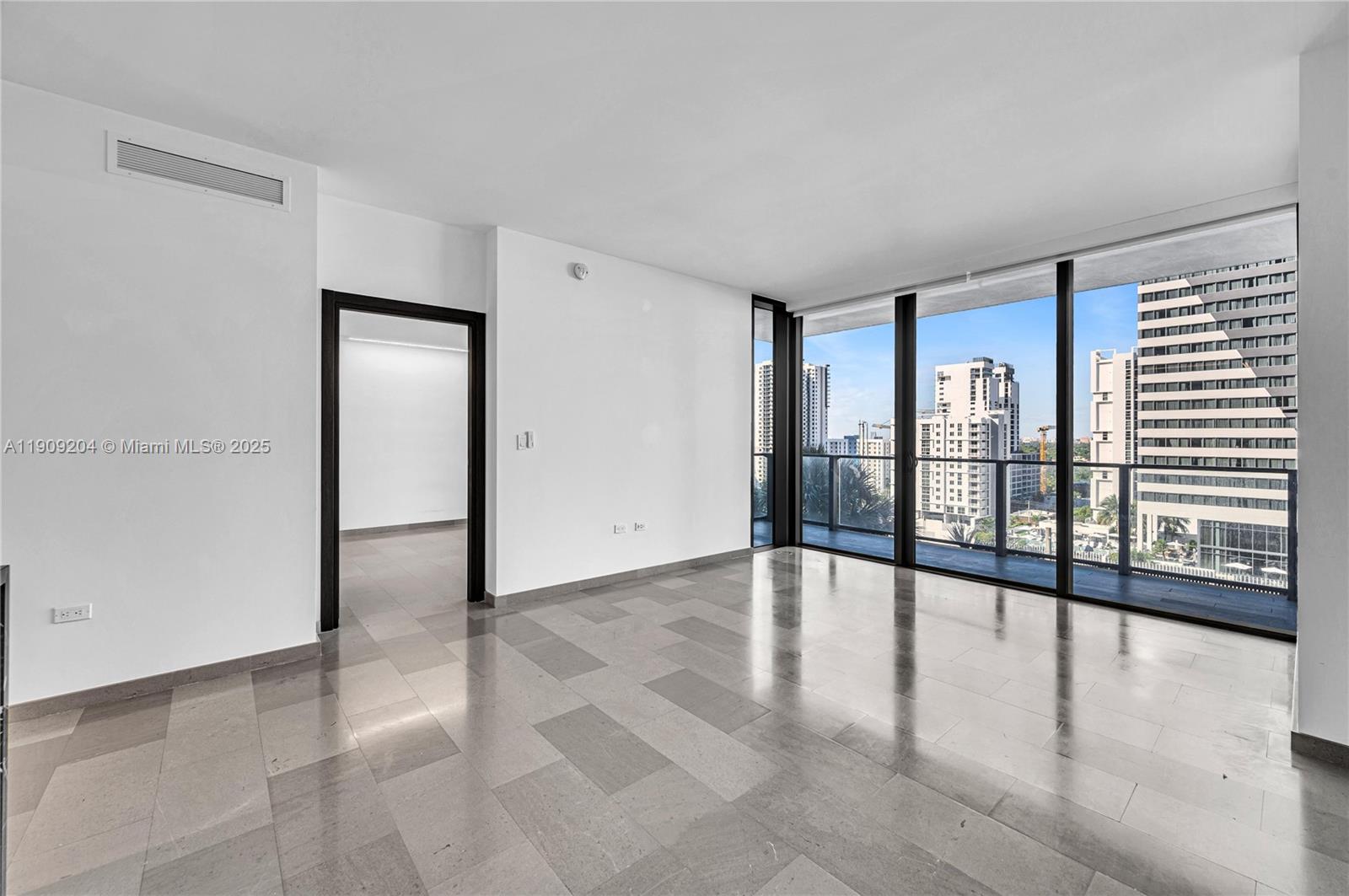 88 Southwest 7th Street, Unit 806 Miami, FL 33130 - Photo 13 of 54 wooden floor in an empty room with a window