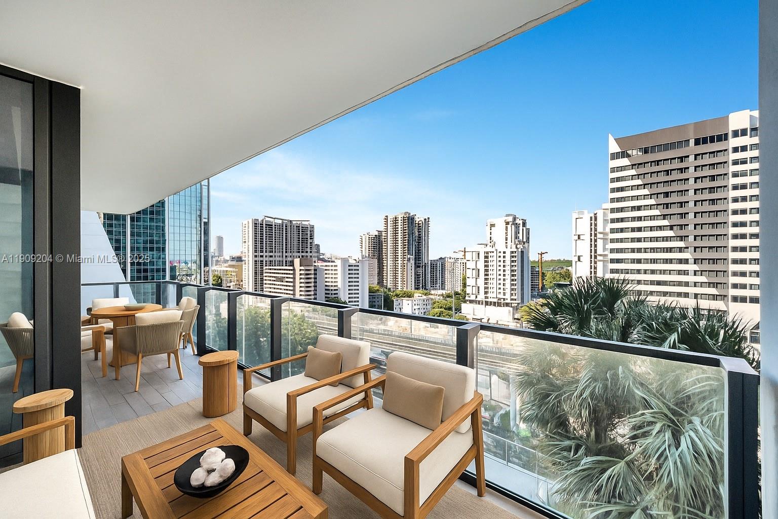 88 Southwest 7th Street, Unit 806 Miami, FL 33130 - Photo 15 of 54 a living room with furniture and a floor to ceiling window