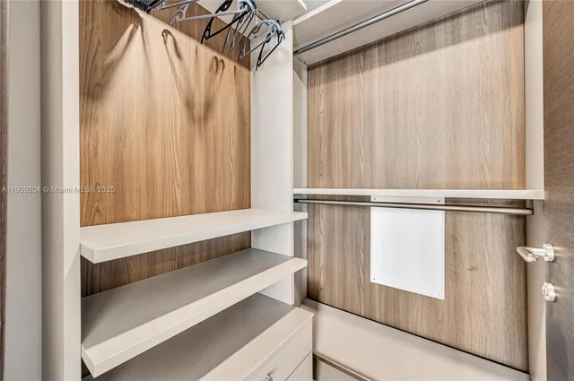 a bedroom with furniture and a closet