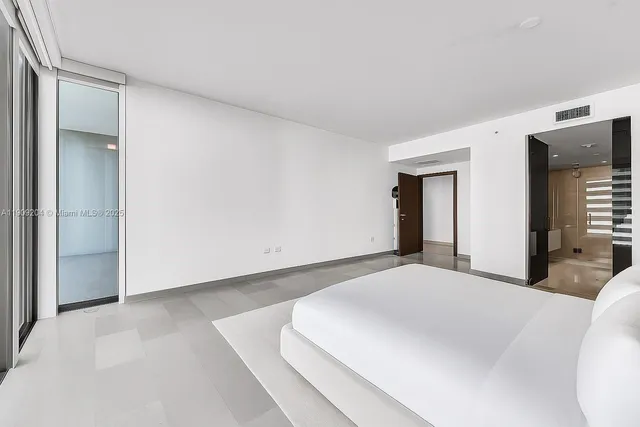 a bathroom with a granite countertop sink mirror and a bathtub