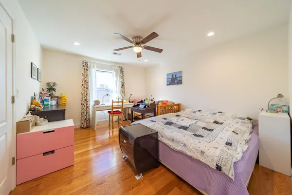 a bed room with a bed and a chandelier