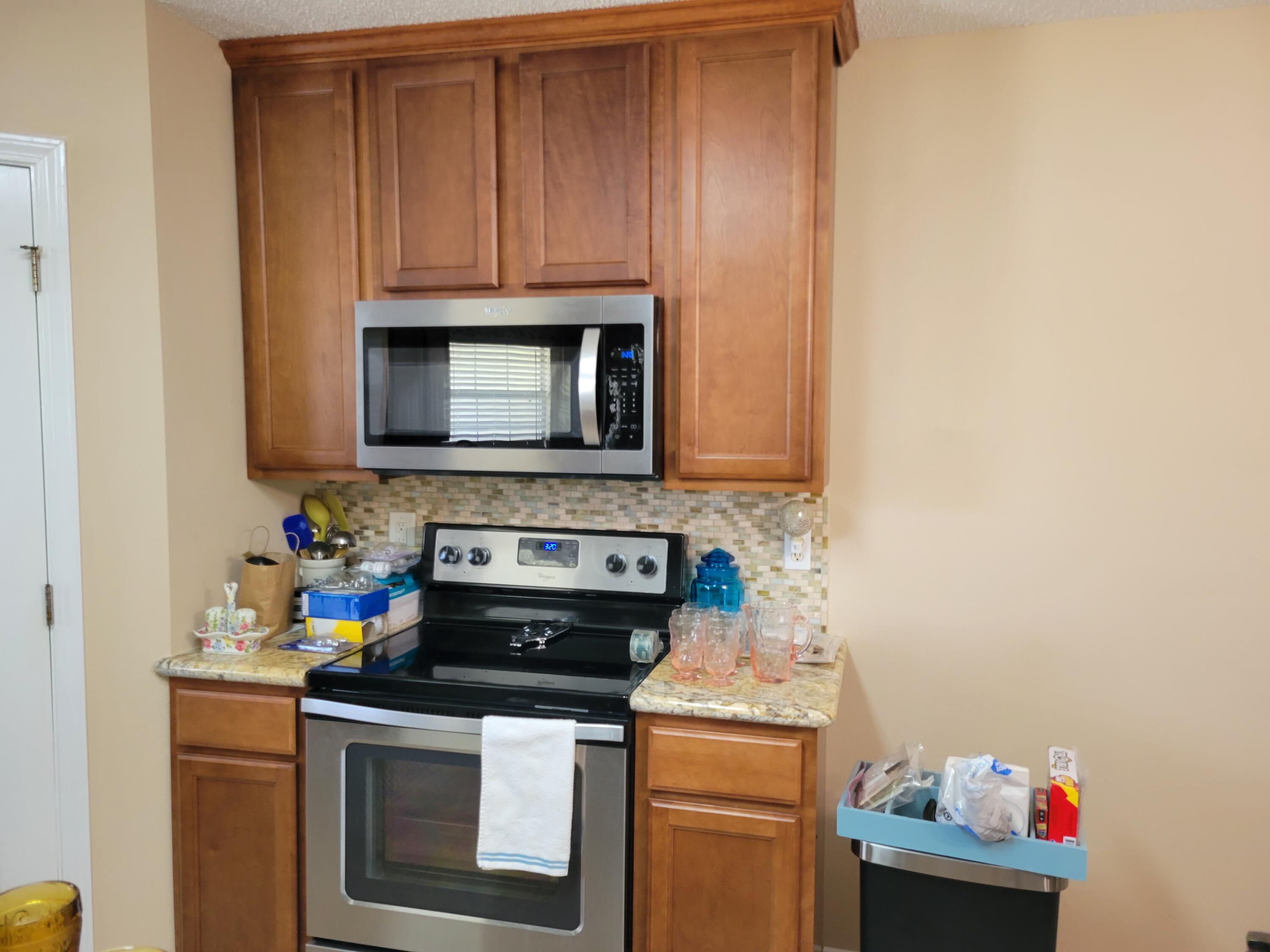 4712 Whitewater Lane Crestview, FL 32539 - Photo 25 of 25 a kitchen with a stove and a microwave