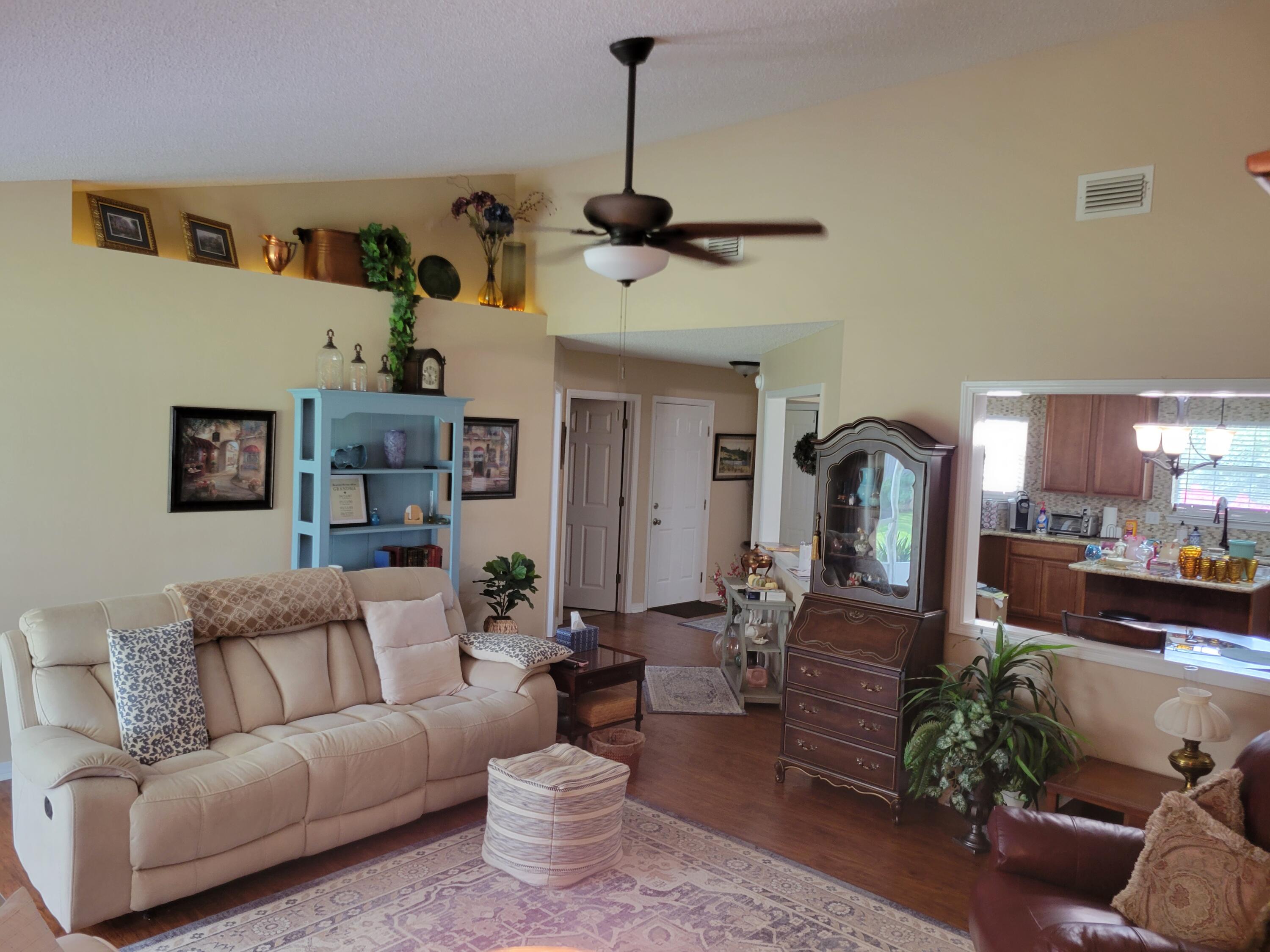 4712 Whitewater Lane Crestview, FL 32539 - Photo 8 of 25 a living room with furniture and a wooden floor