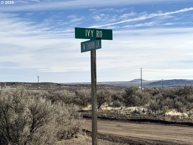 a sign board on the side of the road