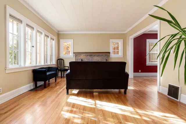 a living room with furniture and a fireplace