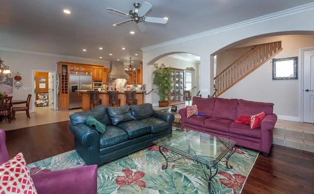 a kitchen with lots of counter top space appliances and cabinets