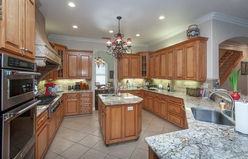 1111 Brighton Way Lodi, CA 95242 - Photo 17 of 87 a kitchen with lots of counter top space appliances and cabinets