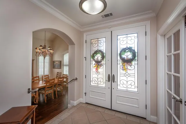 a spacious bathroom with a tub sink and mirror