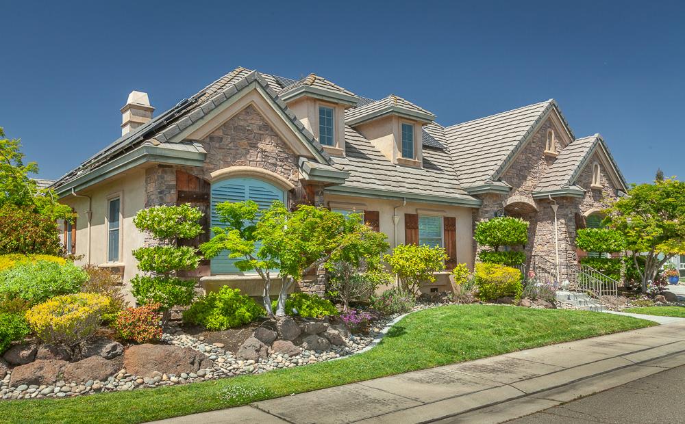 1111 Brighton Way Lodi, CA 95242 - Photo 3 of 87 front view of a house with a garden