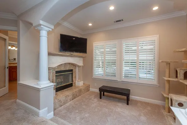 a room with a table chairs and wooden floor