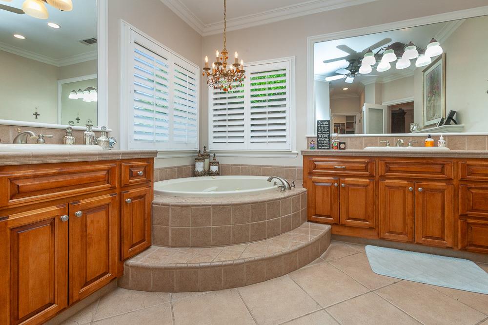 1111 Brighton Way Lodi, CA 95242 - Photo 38 of 87 a spacious bathroom with a tub sink and mirror
