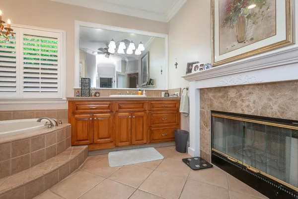 a living room with stainless steel appliances furniture stove and flat screen tv
