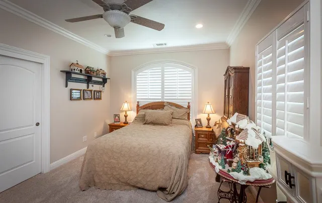 a view of a patio with couches table and chairs potted plants