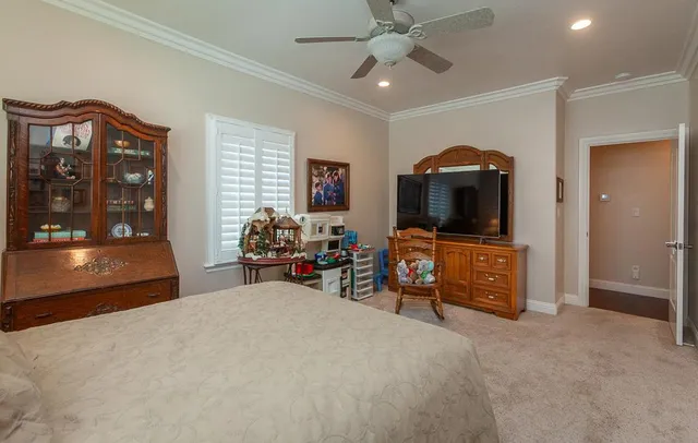 a view of a house with a swimming pool lawn chairs and a yard