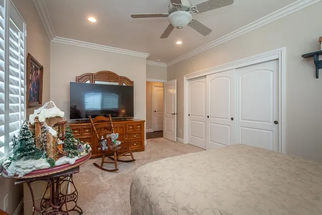 a view of a chair and tables in the backyard of a house