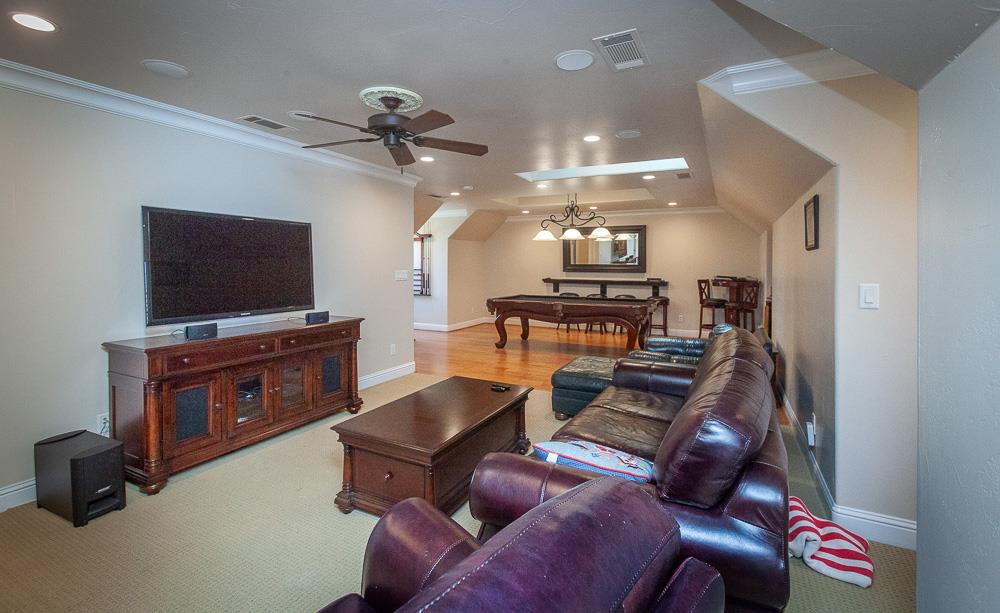 1111 Brighton Way Lodi, CA 95242 - Photo 58 of 87 a living room with furniture and a flat screen tv