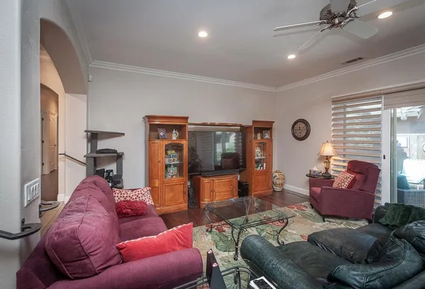 a living room with furniture and a large window
