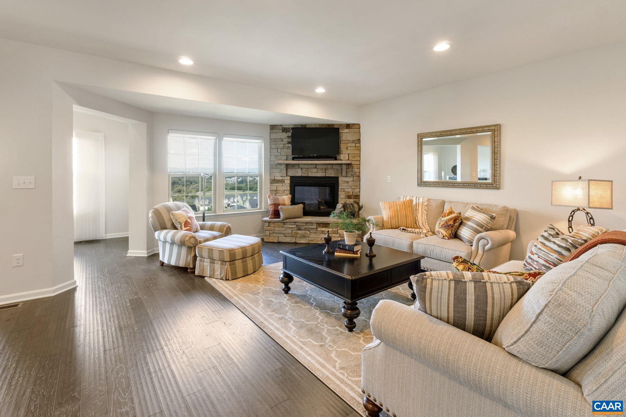 1516 Delphi Lane Charlottesville, VA 22911 - Photo 26 of 74 a living room with furniture and a fireplace