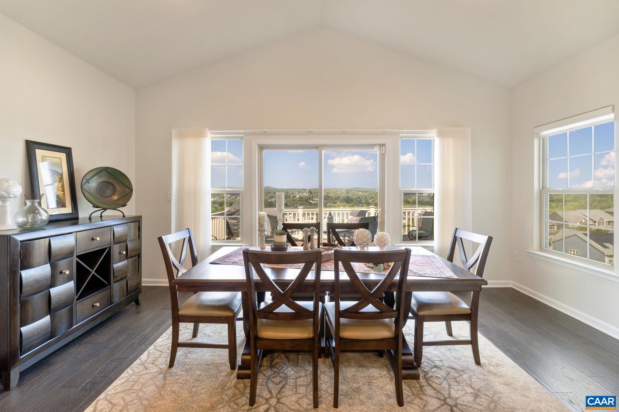 1516 Delphi Lane Charlottesville, VA 22911 - Photo 31 of 74 a view of a dining room with furniture a rug and wooden floor