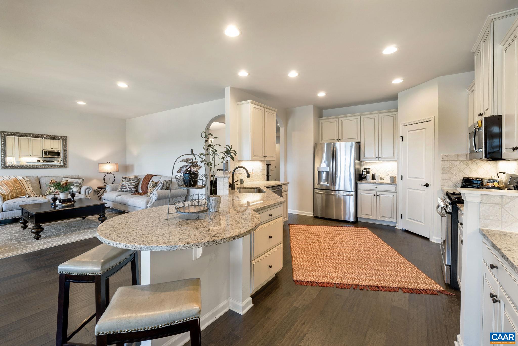 1516 Delphi Lane Charlottesville, VA 22911 - Photo 33 of 74 a large kitchen with kitchen island a large counter top space a sink stainless steel appliances and cabinets