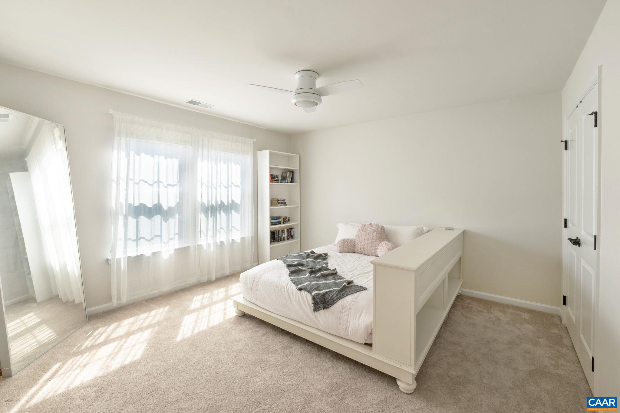 1516 Delphi Lane Charlottesville, VA 22911 - Photo 44 of 74 a living room with furniture and a large window