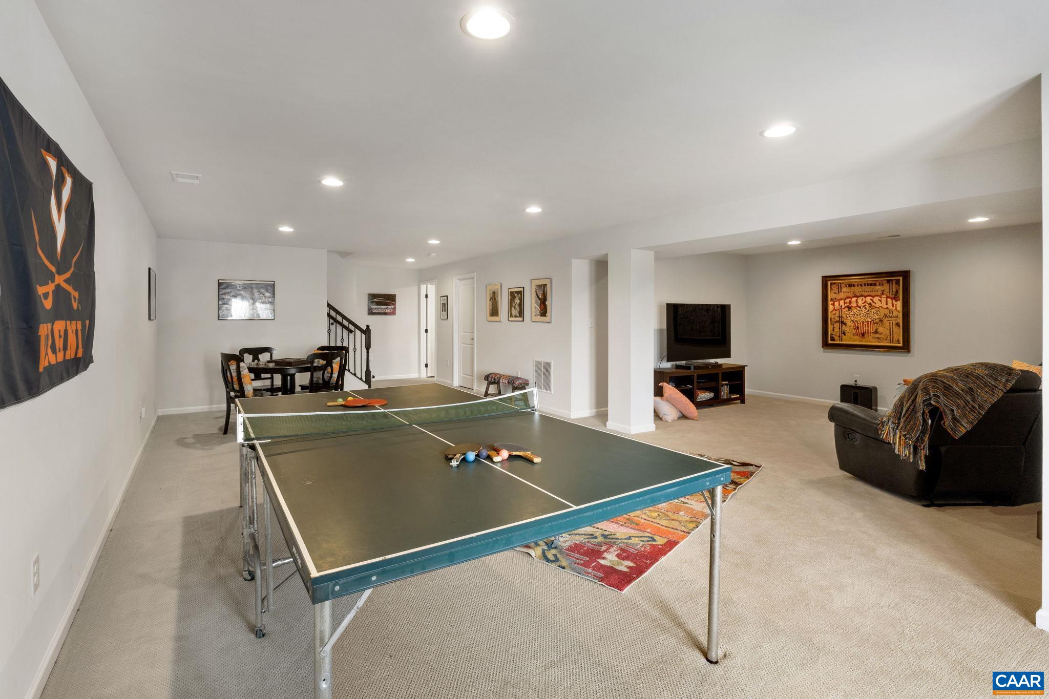 1516 Delphi Lane Charlottesville, VA 22911 - Photo 51 of 74 a living room with furniture pool and a flat screen tv
