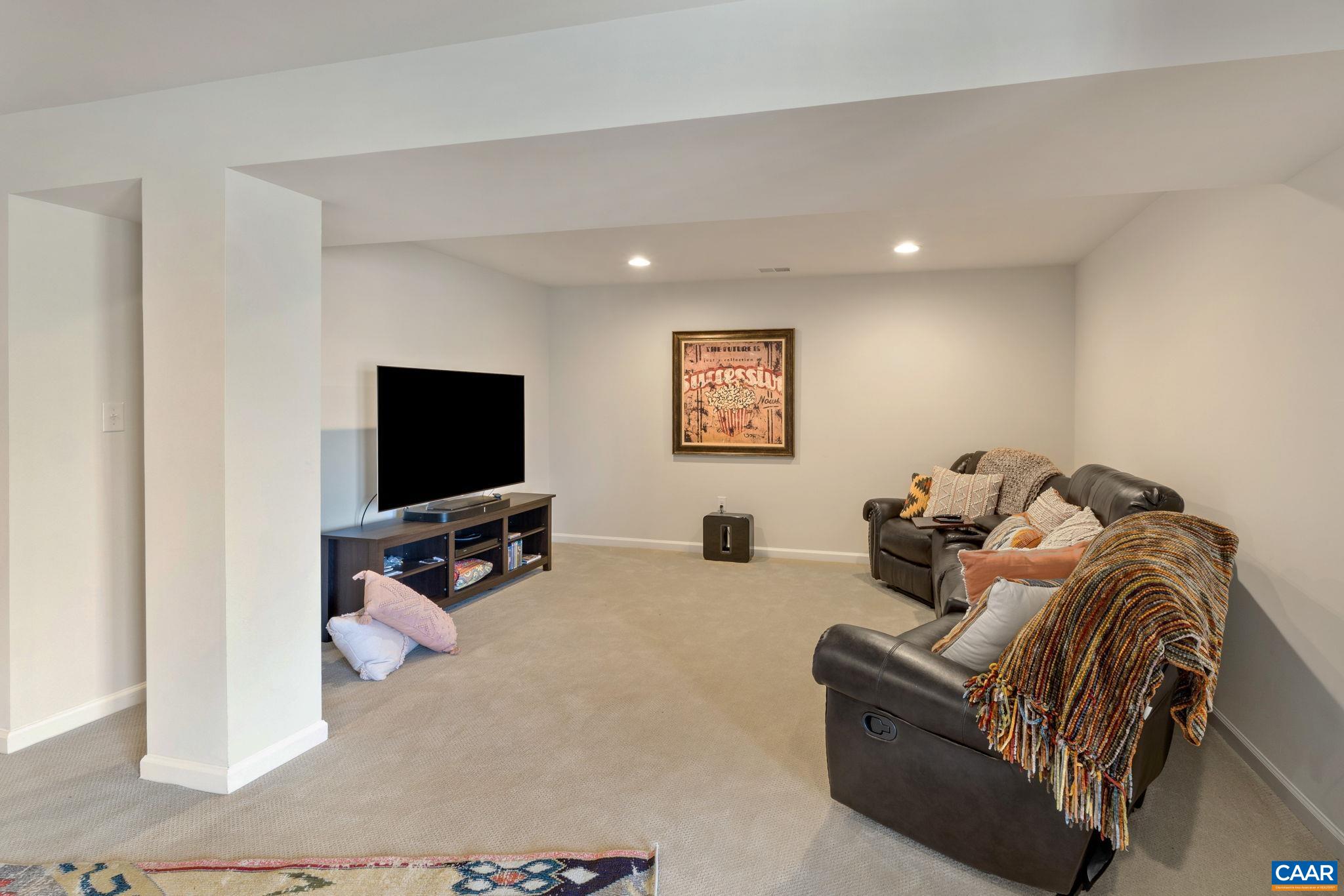 1516 Delphi Lane Charlottesville, VA 22911 - Photo 53 of 74 a living room with furniture and a flat screen tv