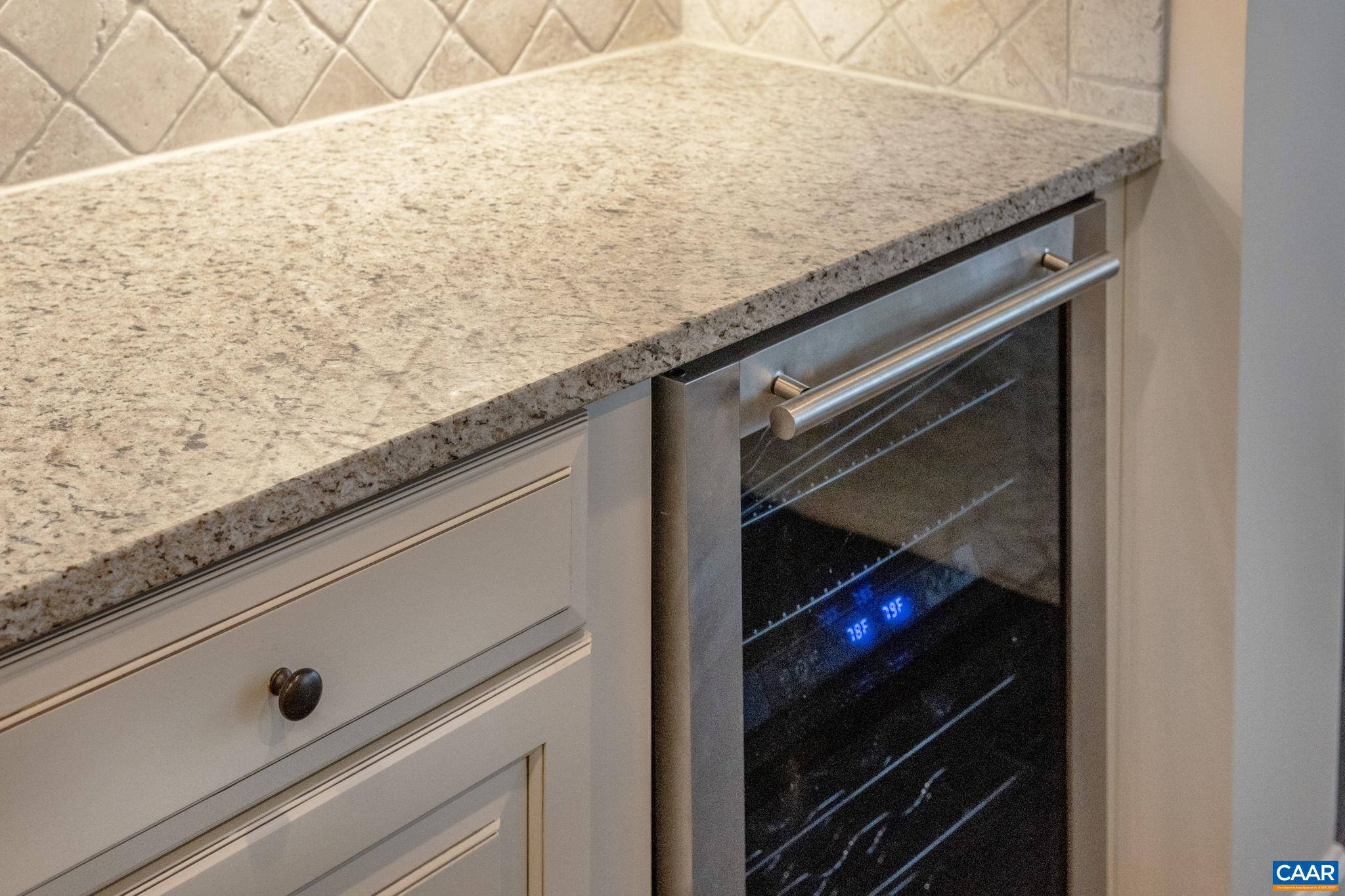 1516 Delphi Lane Charlottesville, VA 22911 - Photo 55 of 74 a close view of kitchen island with a sink and microwave