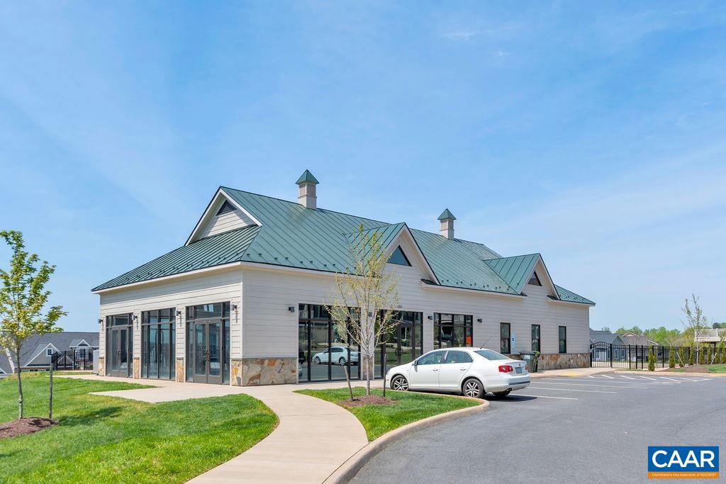 1516 Delphi Lane Charlottesville, VA 22911 - Photo 60 of 74 a front view of a house with a garden and yard